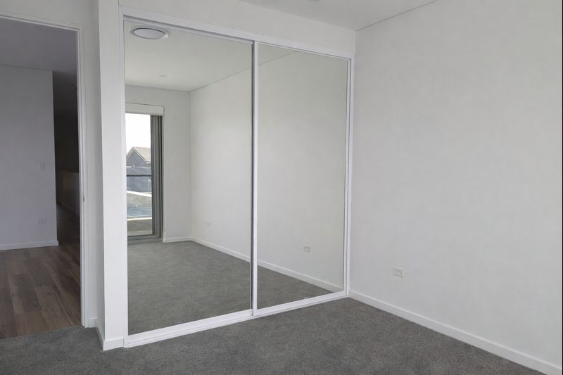 2x Mirrored Sliding Wardrobe Doors With Double Track Kit